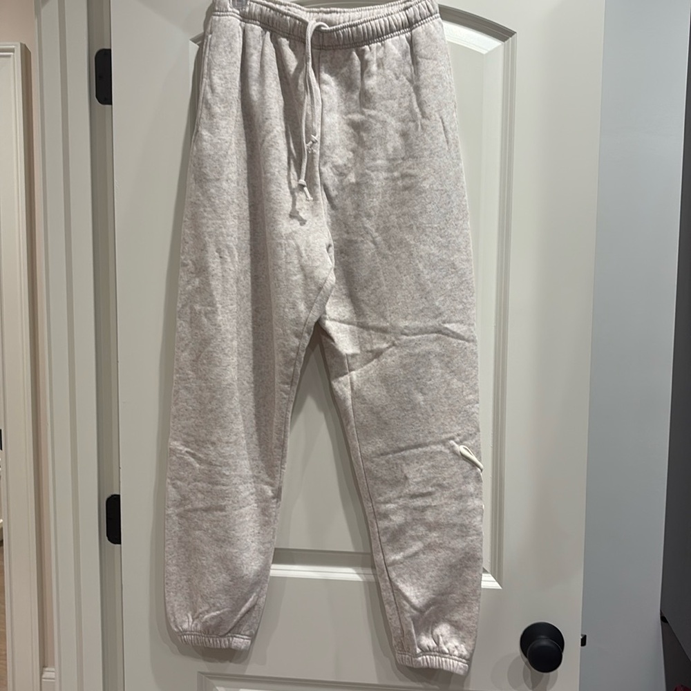 Pink Victoria’s Secret sweatpants, size M.
